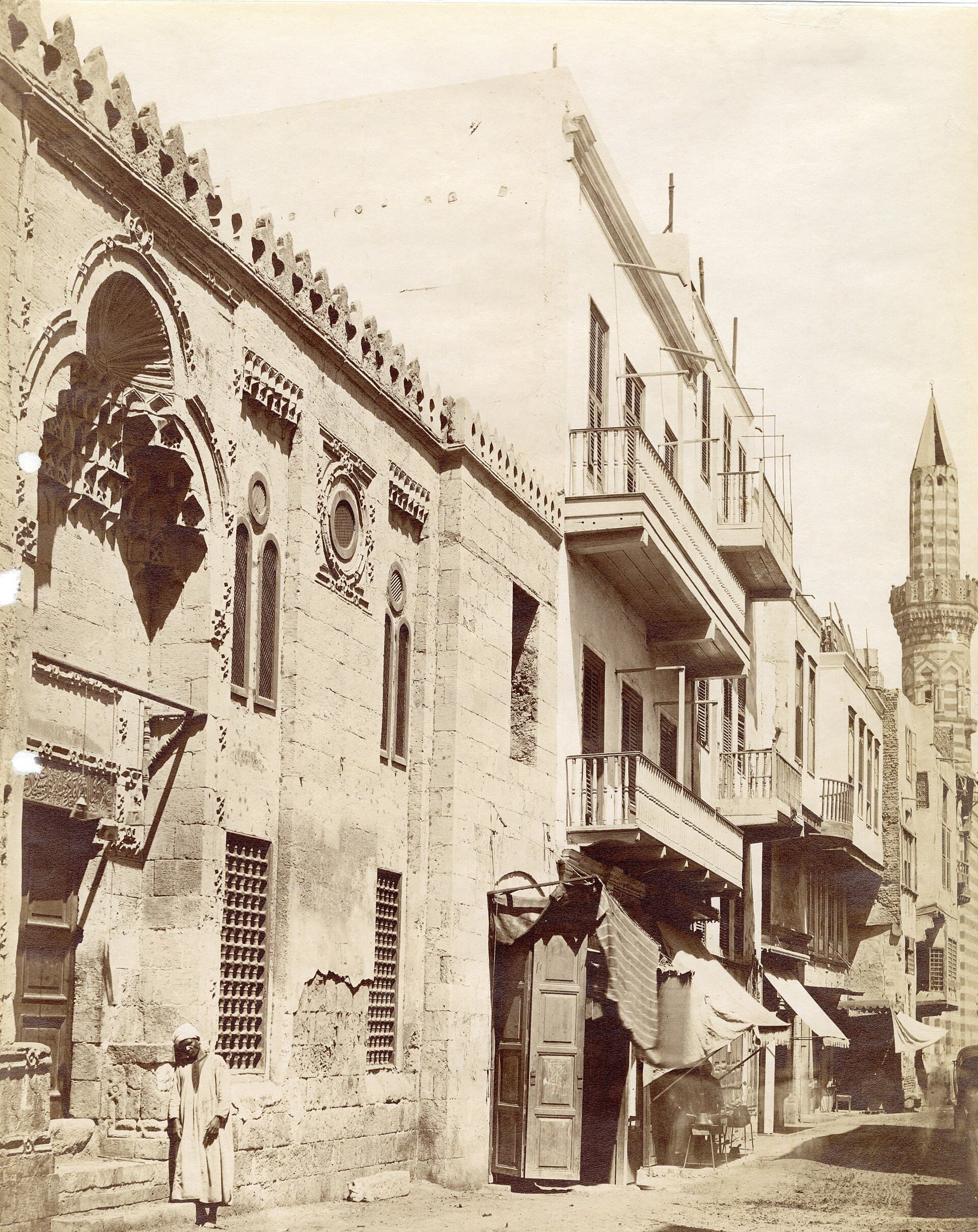 A Mamluk facade and shop awnings on a market street, 19th century. Photographer unknown.