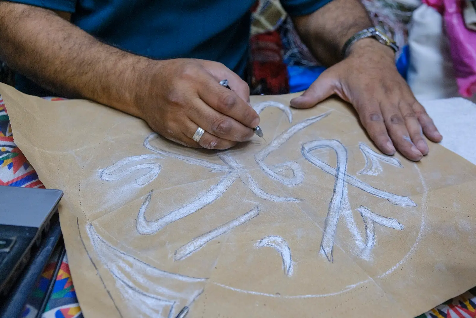 The pattern chalked onto cloth before it is cut